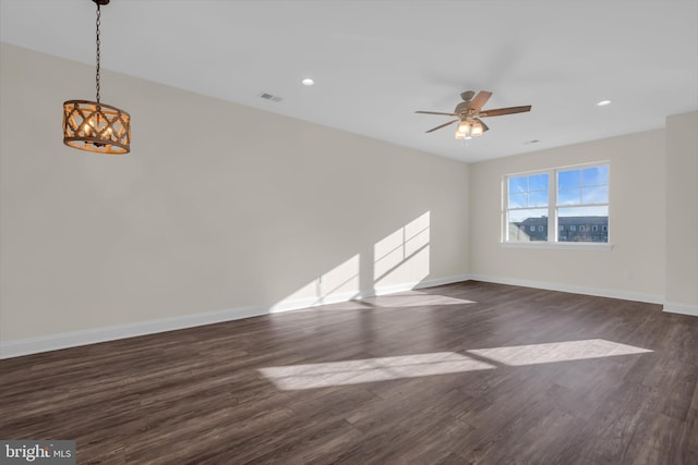 unfurnished room with ceiling fan and dark hardwood / wood-style floors