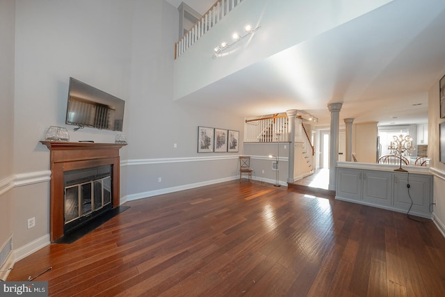 unfurnished living room featuring dark hardwood / wood-style floors