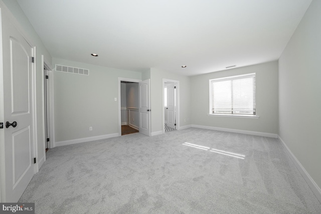 unfurnished bedroom with light carpet