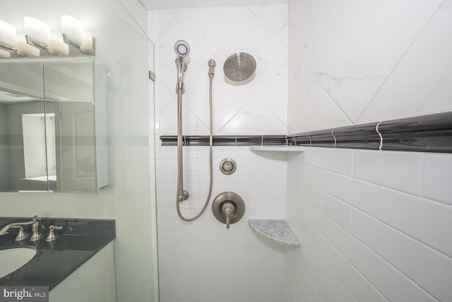 bathroom featuring sink and tiled shower