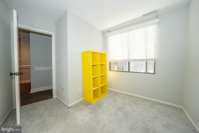 unfurnished bedroom featuring light colored carpet