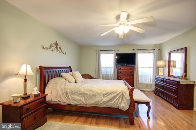 bedroom featuring ceiling fan and light hardwood / wood-style flooring