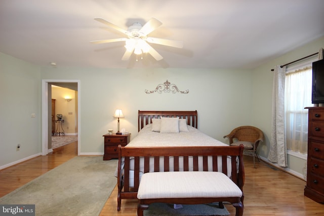 bedroom featuring light hardwood / wood-style flooring and ceiling fan