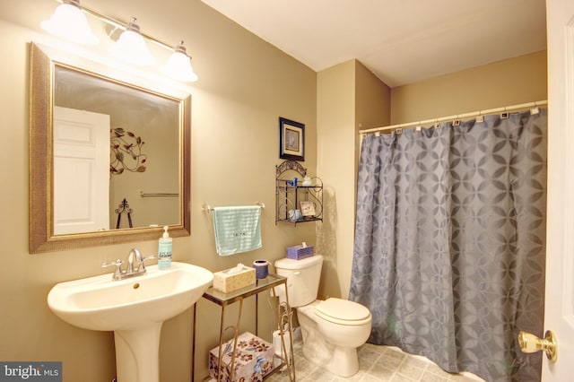 bathroom with sink and toilet