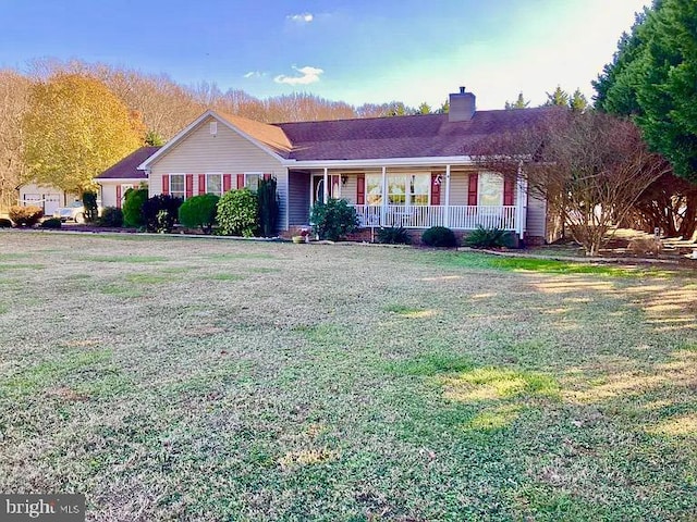 single story home featuring a front lawn and covered porch