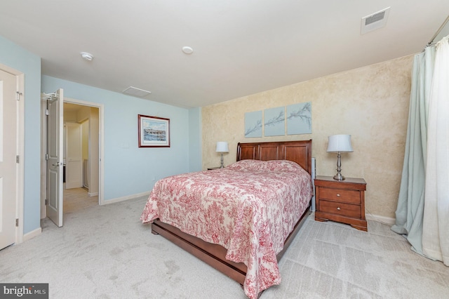 bedroom with light carpet