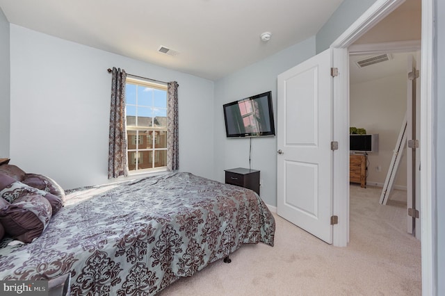 bedroom featuring light colored carpet