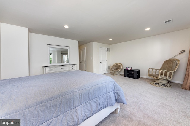 bedroom with light carpet