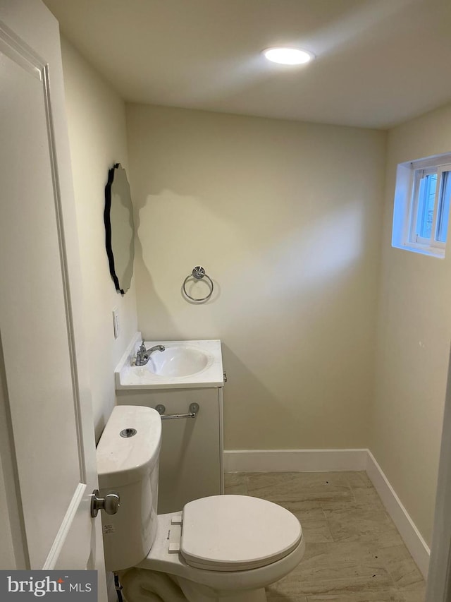 bathroom with toilet and vanity