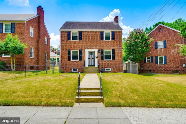 colonial home featuring a front lawn