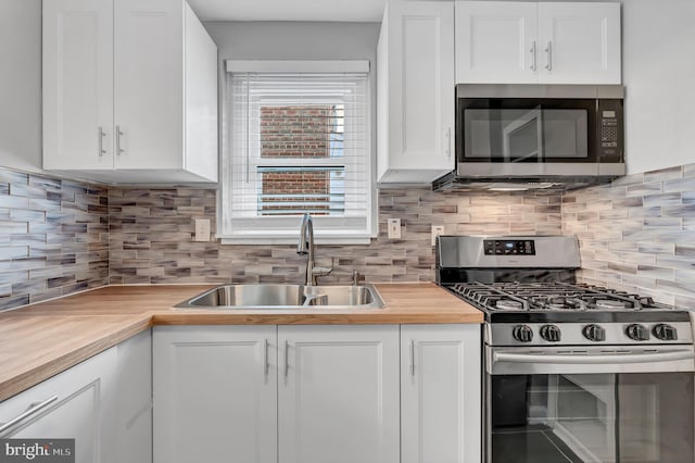 kitchen featuring white cabinetry, sink, and stainless steel appliances