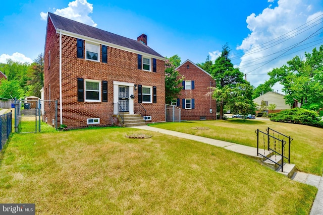 colonial-style house with a front lawn