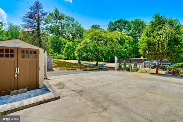 view of patio with a storage shed