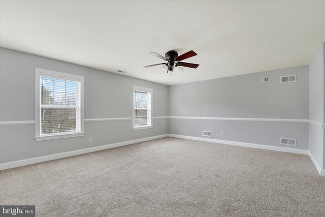 unfurnished room with ceiling fan and carpet floors