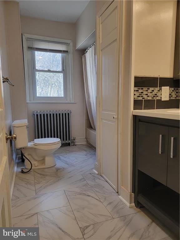 full bathroom with vanity, backsplash, toilet, shower / tub combo with curtain, and radiator heating unit