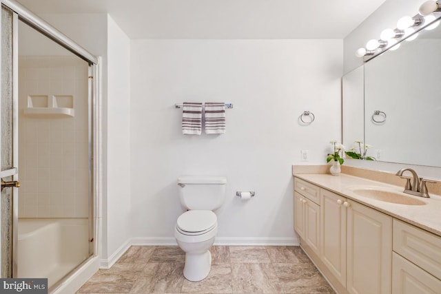 bathroom featuring toilet, a shower with shower door, baseboards, and vanity