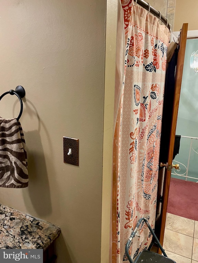 bathroom featuring tile patterned flooring