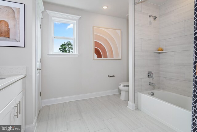 full bathroom with vanity, toilet, and shower / bath combo with shower curtain