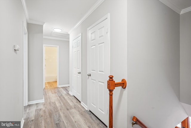 corridor featuring light hardwood / wood-style flooring and ornamental molding