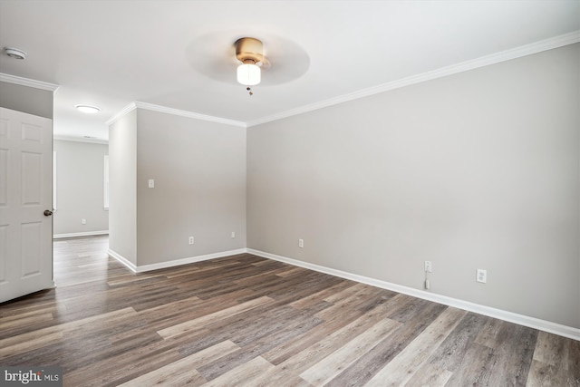 spare room with ceiling fan, wood-type flooring, and crown molding