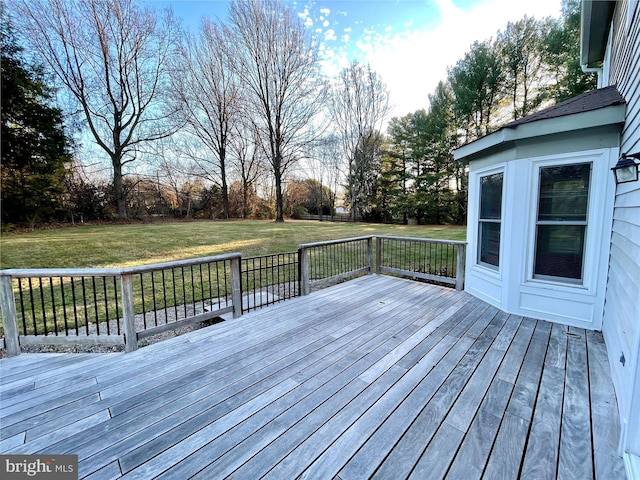 wooden terrace with a yard