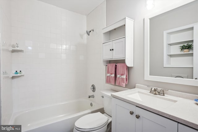 full bathroom featuring toilet, vanity, and tiled shower / bath combo