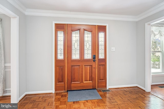 entrance foyer featuring light parquet floors and ornamental molding