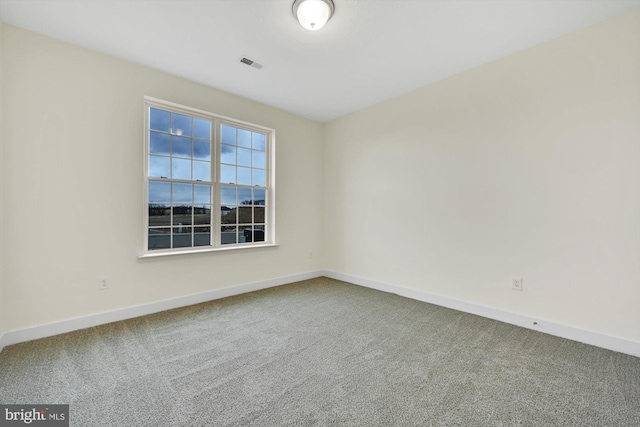 empty room featuring carpet flooring