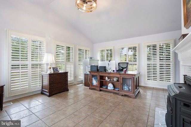 tiled office featuring a healthy amount of sunlight and vaulted ceiling