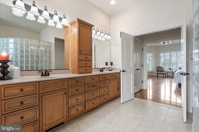 bathroom featuring tile patterned flooring and vanity