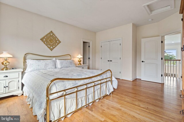 bedroom featuring light hardwood / wood-style floors and a closet