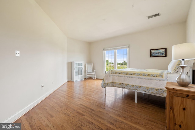 bedroom with light hardwood / wood-style floors