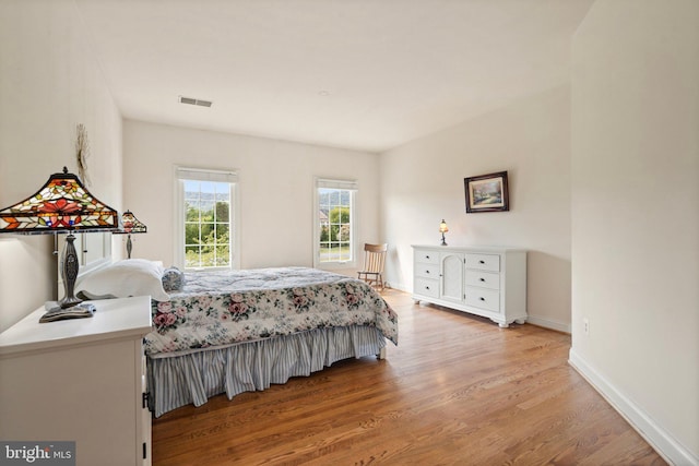 bedroom with hardwood / wood-style floors