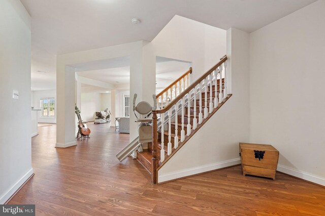 stairs featuring wood-type flooring