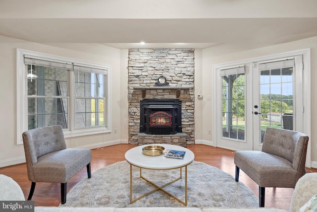 living room with hardwood / wood-style floors and french doors