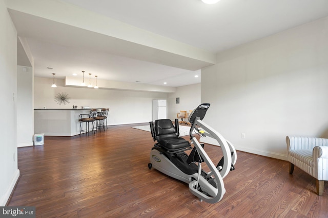 workout room featuring dark hardwood / wood-style floors