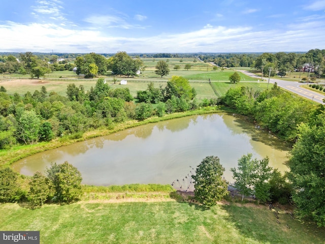 drone / aerial view with a water view and a rural view