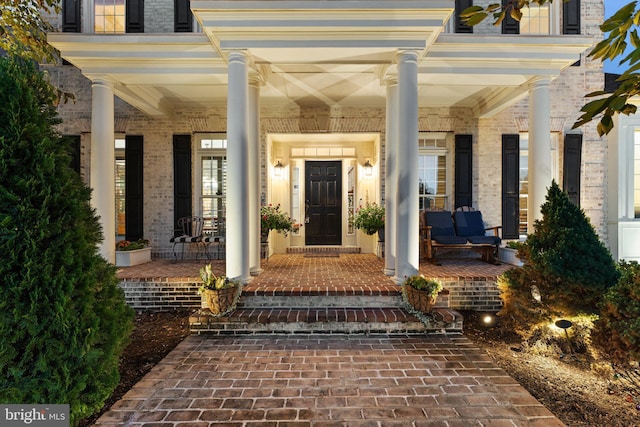 entrance to property with a porch