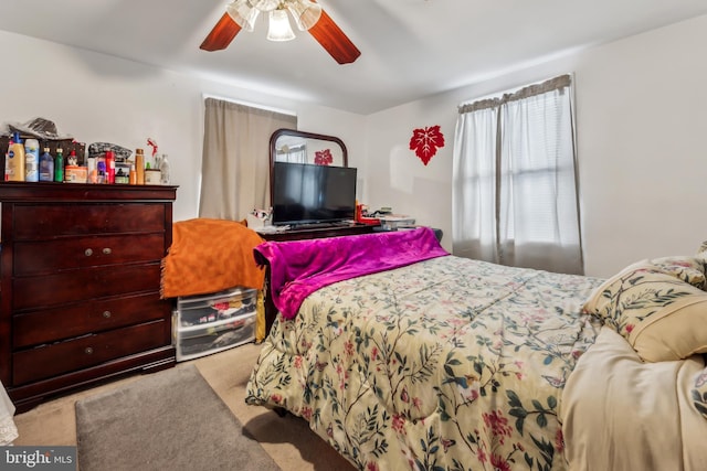 carpeted bedroom featuring a ceiling fan