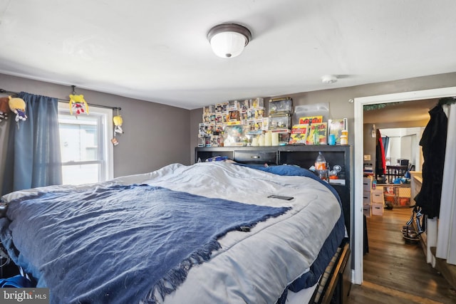 bedroom with wood finished floors