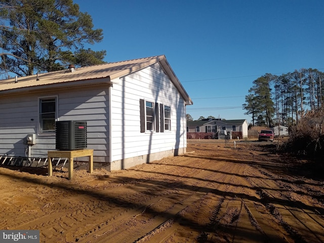 view of side of property featuring cooling unit