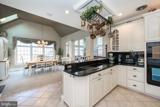 kitchen featuring kitchen peninsula, light colored carpet, vaulted ceiling, black appliances, and white cabinetry