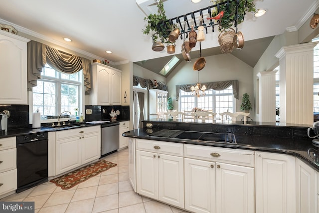 kitchen with backsplash, sink, black appliances, a notable chandelier, and white cabinetry