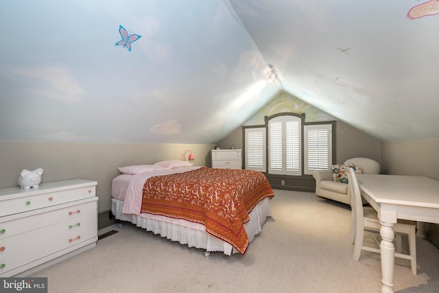 bedroom featuring light colored carpet and lofted ceiling