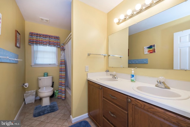 full bathroom with tile patterned floors, shower / bath combo with shower curtain, vanity, and toilet