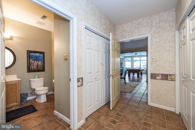 bathroom featuring toilet and billiards