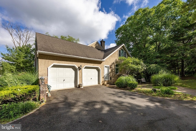 view of property exterior with a garage