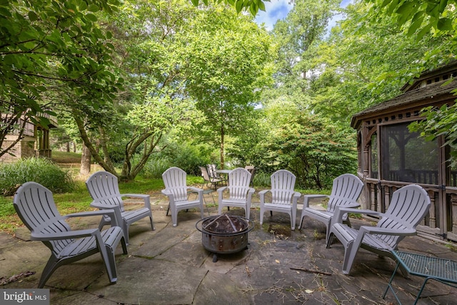 view of patio / terrace featuring an outdoor fire pit