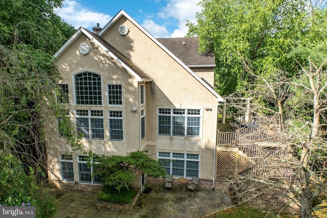 rear view of house with a patio