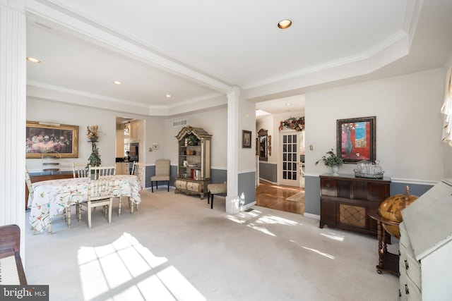 carpeted living room with ornamental molding